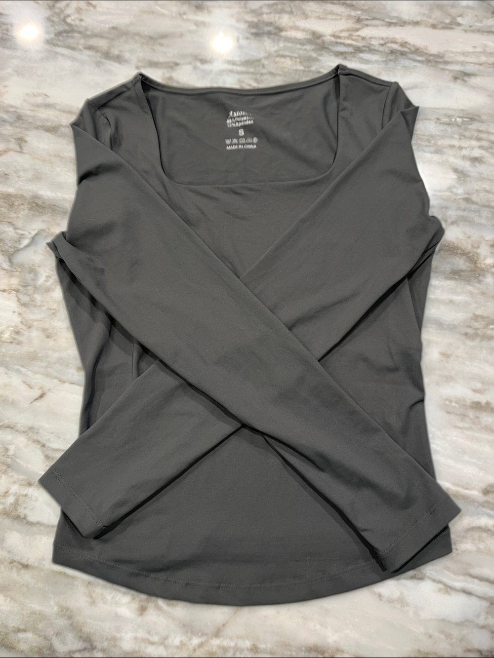 Grey long sleeve spandex top. Square neck.